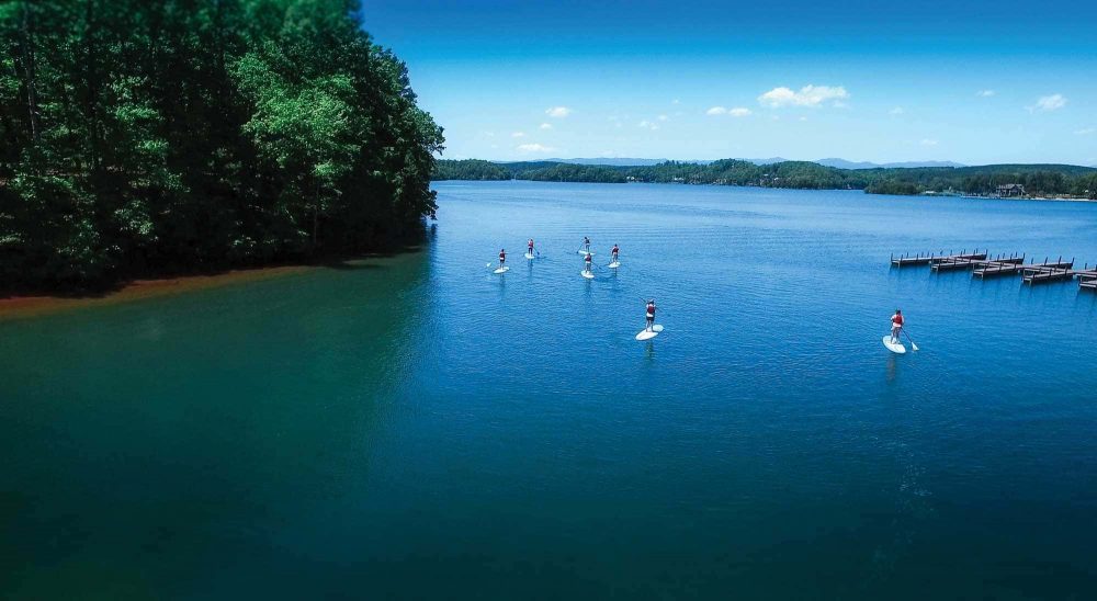 lake living paddle boarders